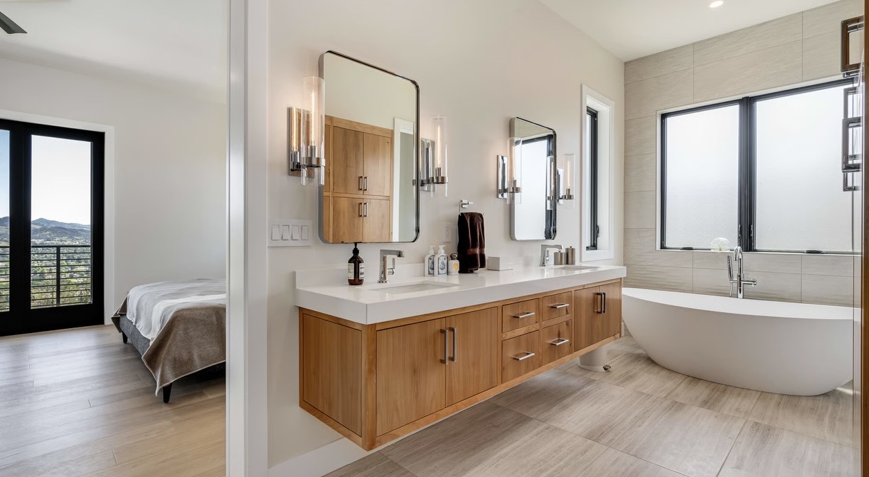 Luxury bathroom with modern vanity lighting and illuminated mirrors