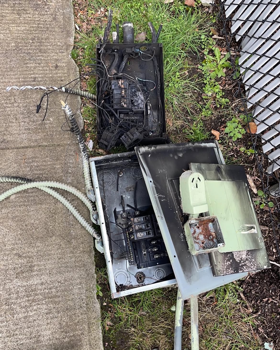 Failed panel and meter base cut out and removed from the wall